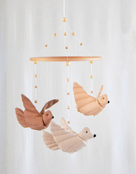 istock Handmade bird baby mobile with natural colors 2235973061