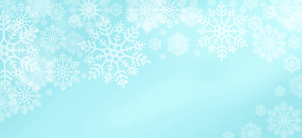 istock Delicate white snowflakes against a soft blue background celebrating winter's beauty 2235984985