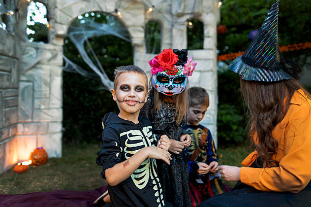 three little girls in carnival masks having fun