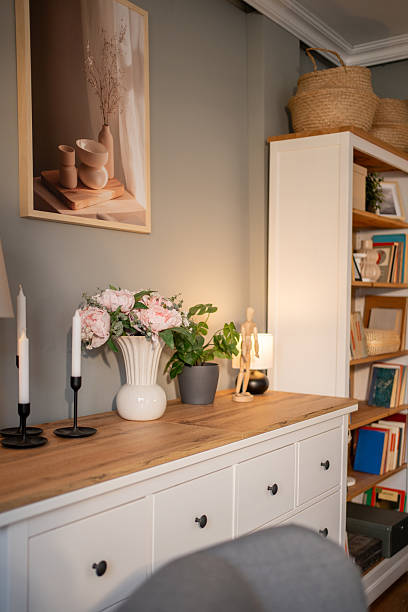 istock Modern interior design with pink peonies and candles adding a touch of elegance 2235988685