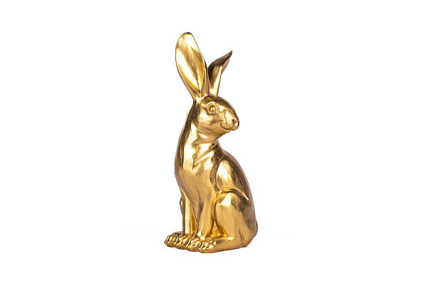 istock Adorable cute gold easter bunny tabletop figurine 2235989486