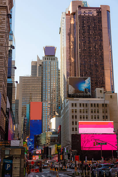 istock Times Square with Digital Billboards and Traffic Jam with Cler Sky 2235990292