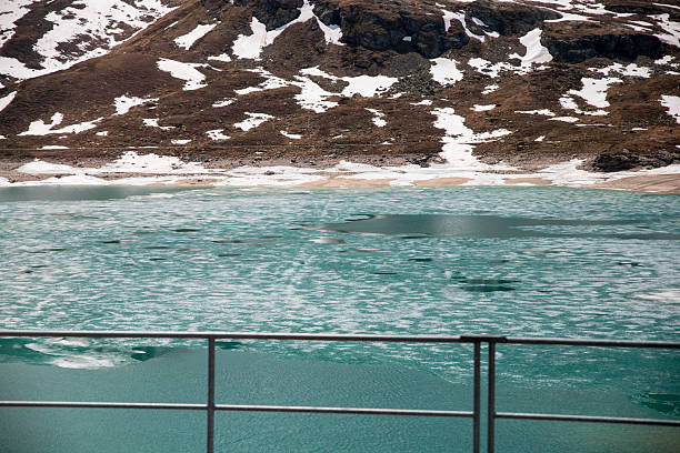 Bernina Express railway line alongside Lago Bianco