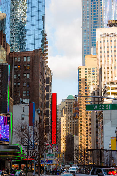 View of central district of New York City with skyscrapers, traffic jam and digital billboards around
