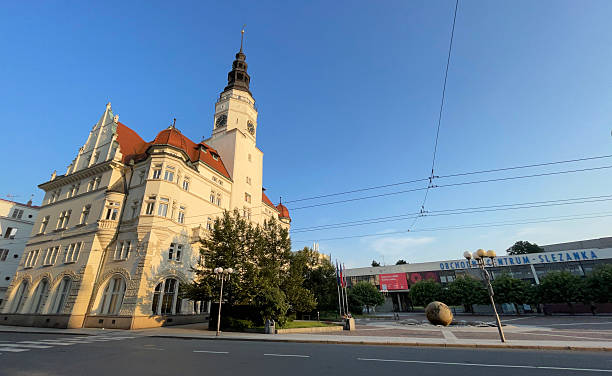 Opava, Czech Republic - June 09, 2024: The City Hall of Opava, stands tall against a clear blue sky, showcasing its clock tower and classic architecture