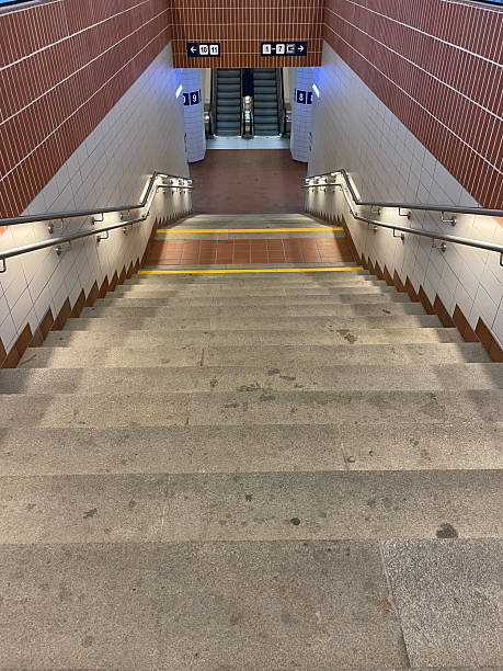 istock Descending stairs leading to escalators in Pardubice train station underpass 2236000483