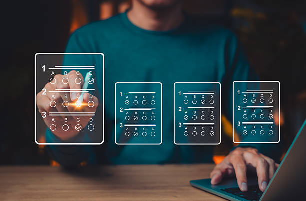 istock Online exam and digital assessment concept with person selecting answers on virtual multiple-choice test interface, representing modern e-learning, education technology and remote testing systems. 2236000485