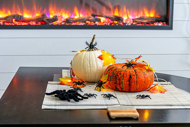 istock Halloween Pumpkins and Spiders Decoration by the Fireplace 2236001093