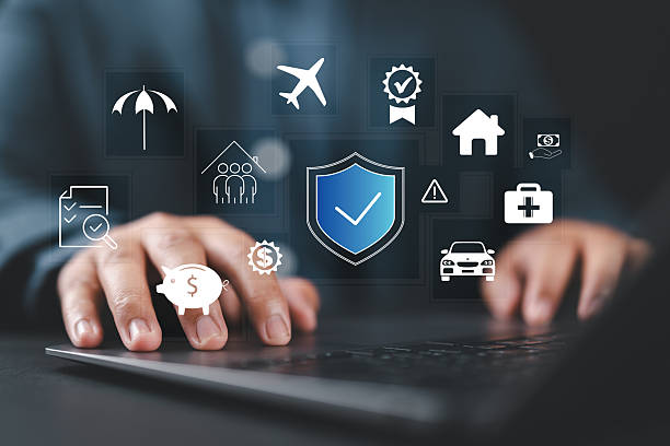 istock Insurance concept. Businessman using a laptop with various digital icons representing different types of insurance, such as health, home, car, travel, comprehensive coverage, and policy management. 2236001833