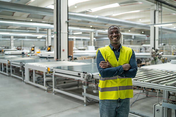istock Confident worker standing proudly in a production facility. 2236005375