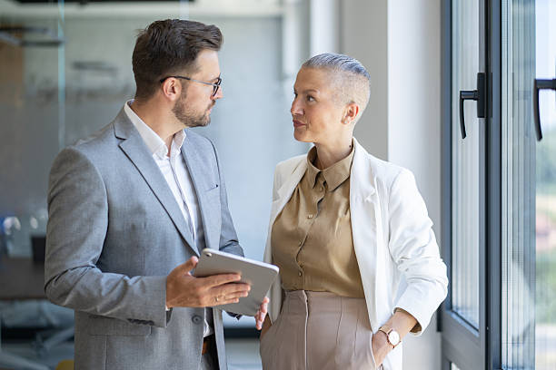 istock Business colleagues discussing work in modern office 2236005546
