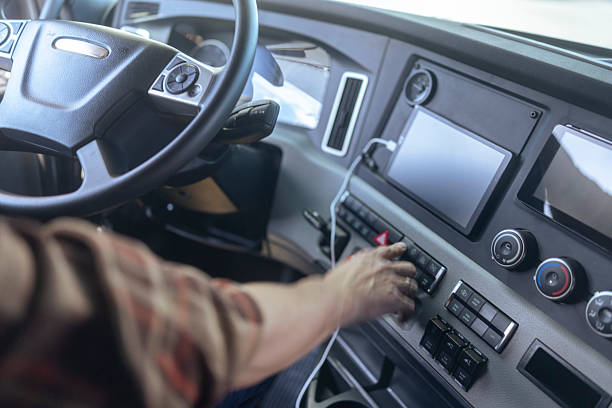 istock Male Truck Driver Operating Modern Dashboard Controls 2236005623