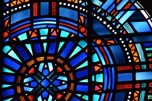istock a close up of a stained glass window with a clock in it 2236009710