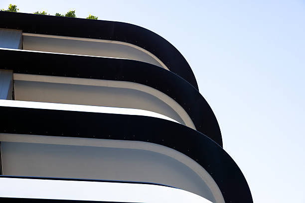 istock Closeup modern apartment building in sunlight, top part, background with copy space 2236010412