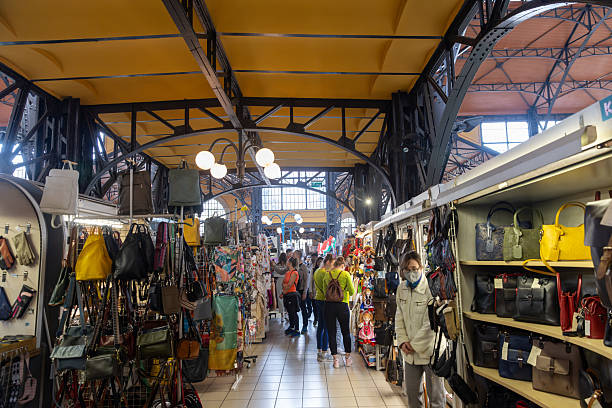 Budapest, Hungary - April 21, 2023: Shoppers and tourists wander the main market hall in Budapest, Hungary