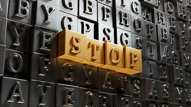 istock STOP.3D illustration of Movable type printing.close up of Movable type printing,3D rendering on gold background. 2236013729