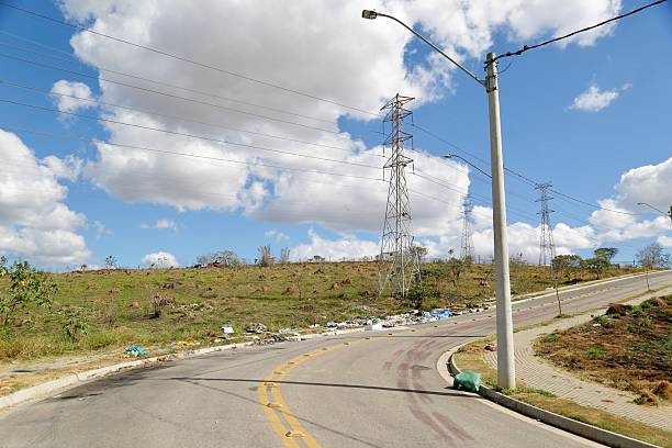 istock Irregular garbage disposal in urban areas, showing environmental pollution and lack of awareness. Ruble, furniture and plastics accumulated on the edges of the street show the impact of human neglect on the environment. 2236014548