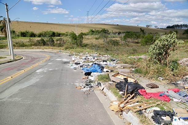 istock Irregular garbage disposal in urban areas, showing environmental pollution and lack of awareness. Ruble, furniture and plastics accumulated on the edges of the street show the impact of human neglect on the environment. 2236014607