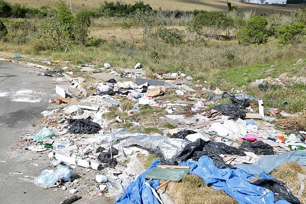 istock Irregular garbage disposal in urban areas, showing environmental pollution and lack of awareness. Ruble, furniture and plastics accumulated on the edges of the street show the impact of human neglect on the environment. 2236014619