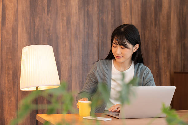 istock asian woman who using laptop 2236015256