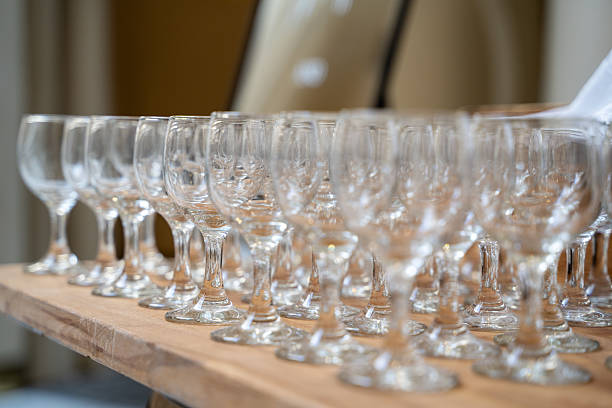 istock Close up of empty wine glasses arranged on wooden table. 2236016577