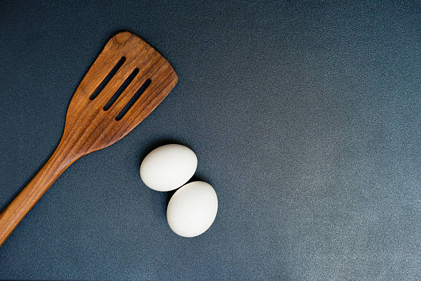 istock Wooden Spatula, Eggs, Griddle Cooking Preparation, Kitchen Utensil Flat Lay 2236017220