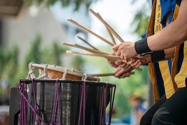 istock Taiko drummers preform at an outdoor stage 2236017699