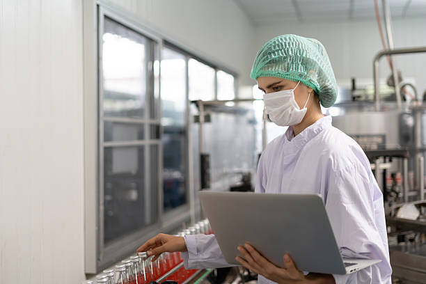 istock quality supervisor food or beverages technician inspection about quality control food or beverages before send product to the customer. Production leader recheck ingredient and productivity. 2236026207