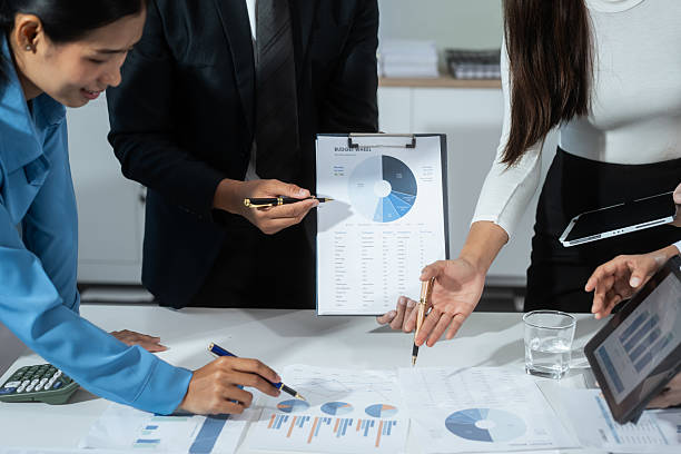 istock Entrepreneurs, marketers, managers, and financial analysts gather around the table to analyze data, present results, plan strategies, discuss efficiencies,grow their businesses through collaboration 2236028393