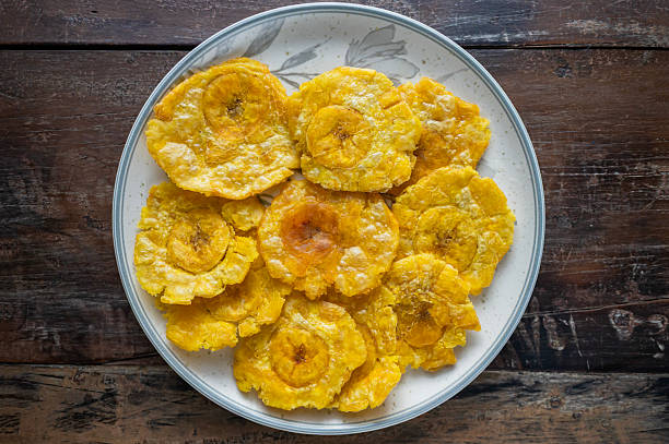 istock Delicious patacones or tostones on ceramic plate 2236028930