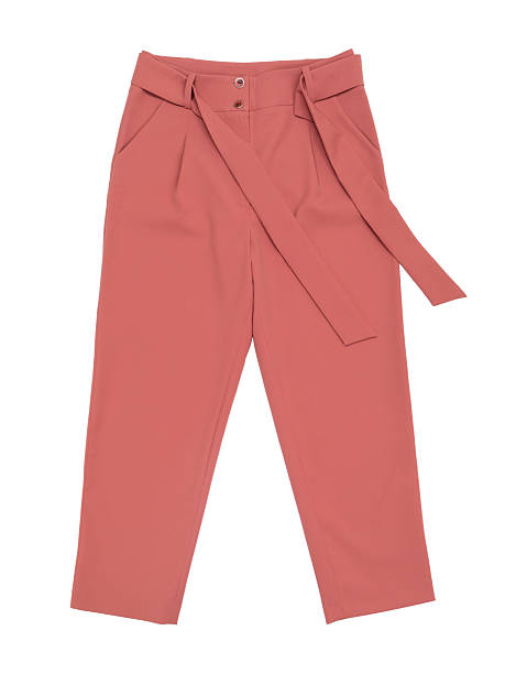 istock A top view of copper-colored women's trousers, isolated on a white background 2236030507