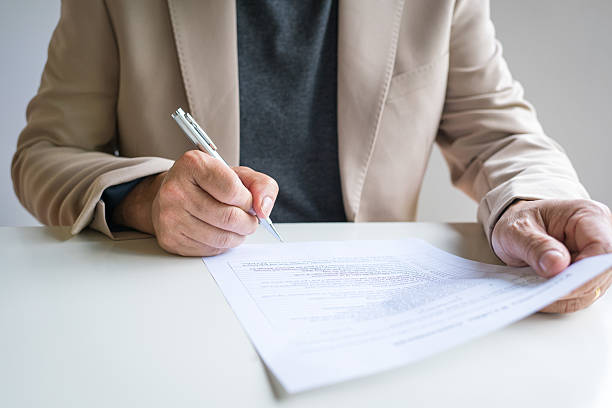 istock Businessman to complete a survey or assessment document. 2236030731