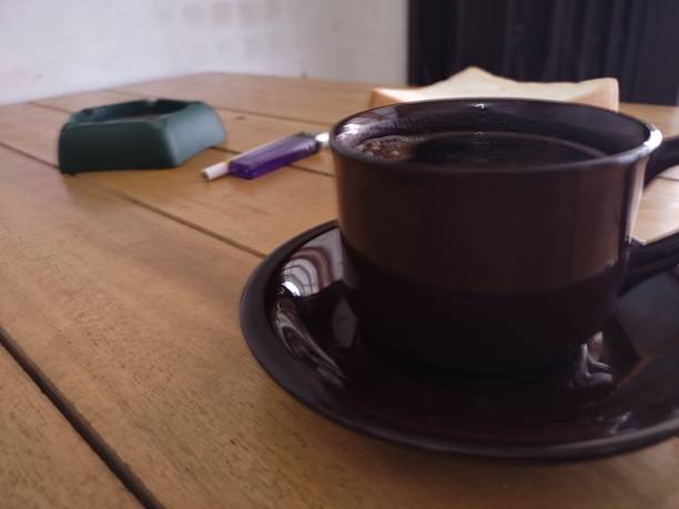 Black Coffee and White Bread on Wooden Table