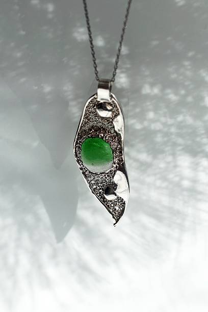 istock Elegant Silver Necklace with Green Stone Pendant. A Statement Piece for Timeless Style. 2236034346