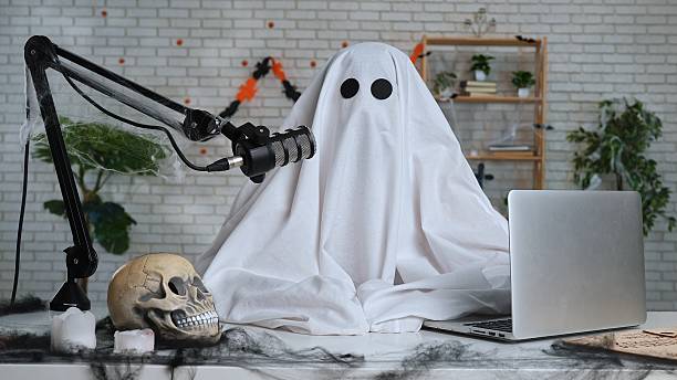 istock Halloween Ghost Podcast or Blog setup with Microphone and Laptop 2236037788