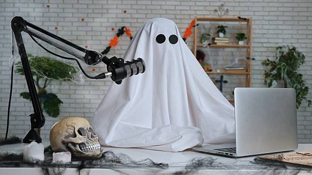 istock Halloween Ghost Podcast or Blog setup with Microphone and Laptop 2236038020