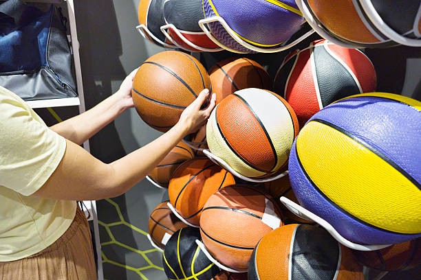 istock Basketballs in hands in the store 2236038058