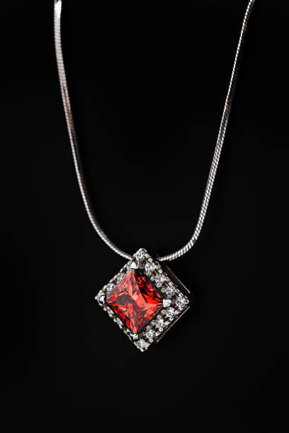istock A white gold necklace with a red gemstone pendant 2236038843