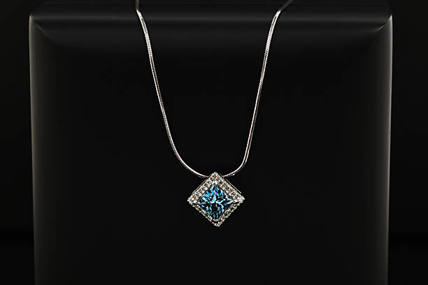istock A blue and white necklace sits on a black surface 2236038951