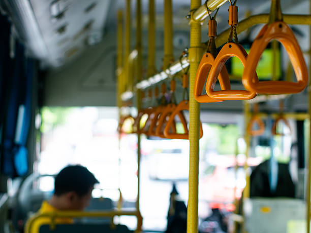 istock Passenger handholds and grab bars inside public transportation bus or train - safety support handles for commuters in urban transit vehicle. 2236039463