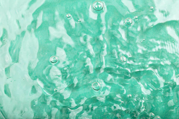 istock Closeup of turquoise water surface with bubbles and ripples creating serene atmosphere 2236039745
