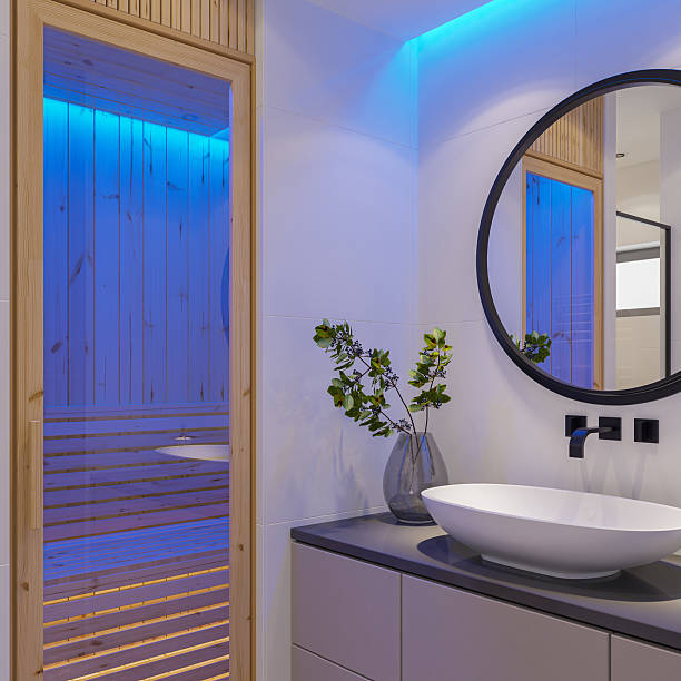 istock Small Modern Bathroom with Sauna and Blue LED Accent Lighting 2236041910