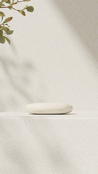 istock Cream podium with leaf shadow on minimal background 2236044828
