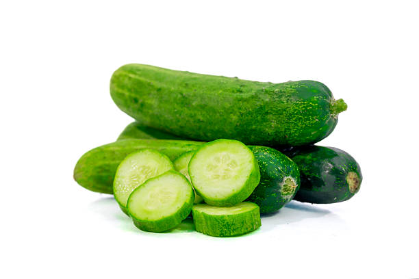 istock Fresh green cucumber with slices isolated on white background 2236047018