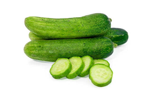 istock Fresh green cucumber with slices isolated on white background 2236047034