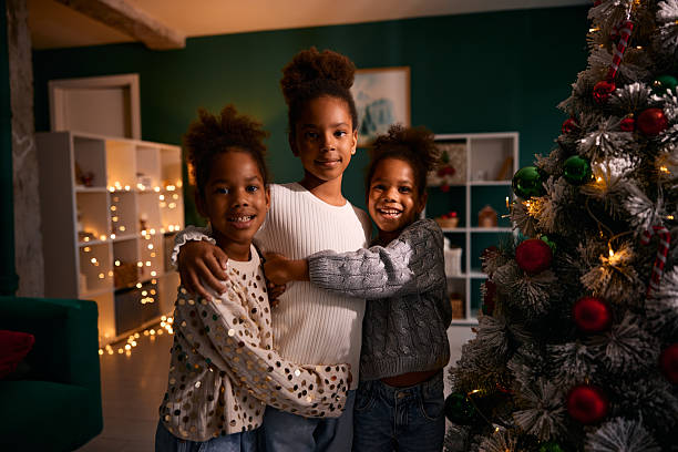 istock Three happy Black sisters hugging during Christmas holiday 2236047046