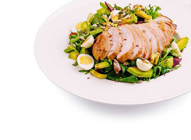 istock Grilled chicken salad with fresh vegetables and hard-boiled eggs on plate 2236049083
