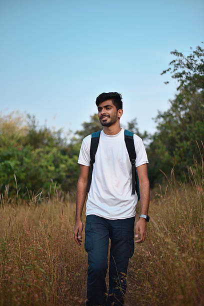 istock Hiker Walking on Narrow Trail Through Tall Grass 2236051791
