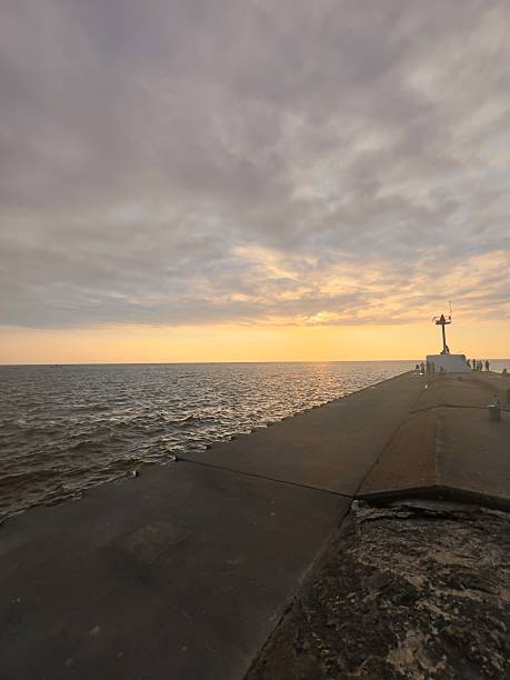 istock Pier at sunset with orange sky. 2236053964