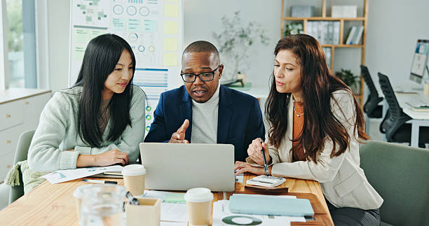 istock Diverse Team Working Collaboratively on Business Strategy in Modern Office Environment 2236059469